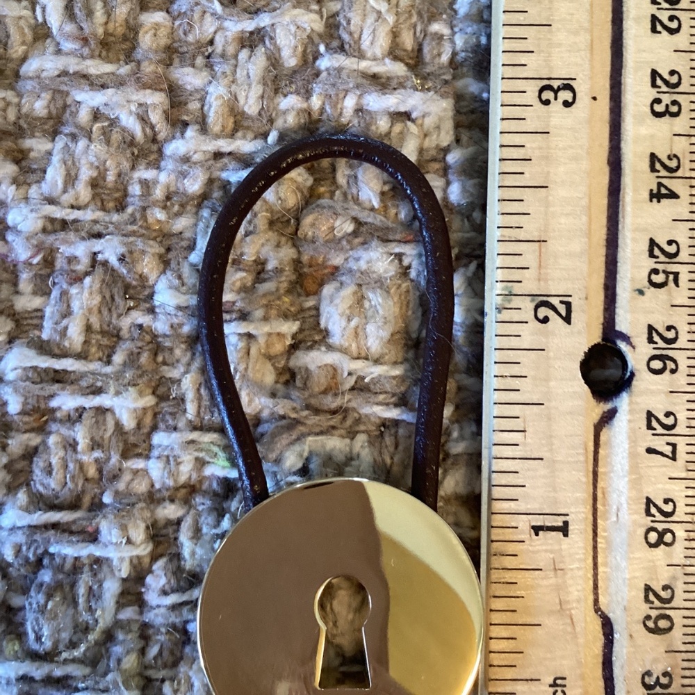 Coach gold tone round key ring with brown closer for adding keys securely. - Picture 5 of 5